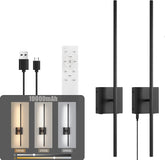 Black wall-mounted light fixture with remote control and USB cable on a white background